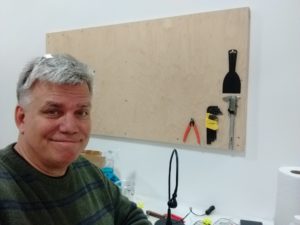 Man with tool board